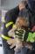 MSK_ostravští hasiči zachraňovali puštíka z komína_hasič drží vysvobozené zvíře.jpg