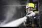 PHA_Požár ve spalovně v Malešicích-detail na zasahujícího hasiče
