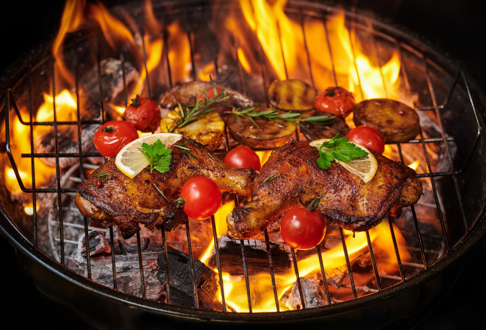 grilled-chicken-legs-flaming-grill-with-grilled-vegetables-with-tomatoes-potatoes-pepper-seeds-salt(1).jpg