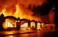 64_PHA_Požár na pražském výstavišti_pohled zepředu na hořící pravé křídlo