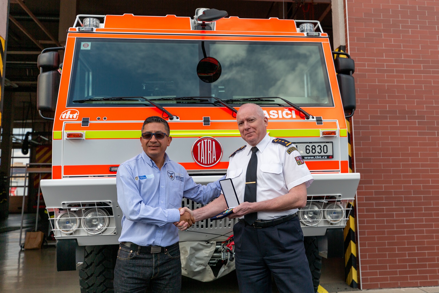 Joint photo in front of fire truck.jpg